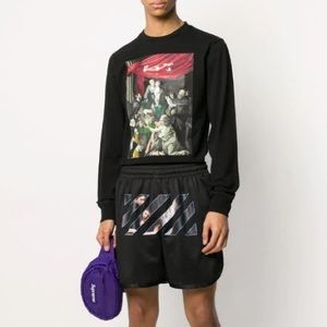 Off-white track shorts.